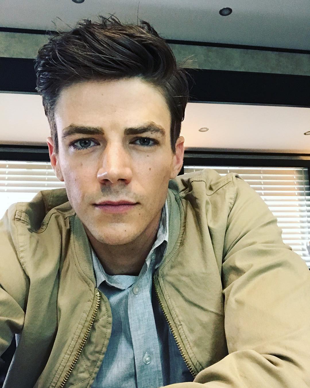The Flashs Grant Gustin reacts to Hartley Sawyers firing